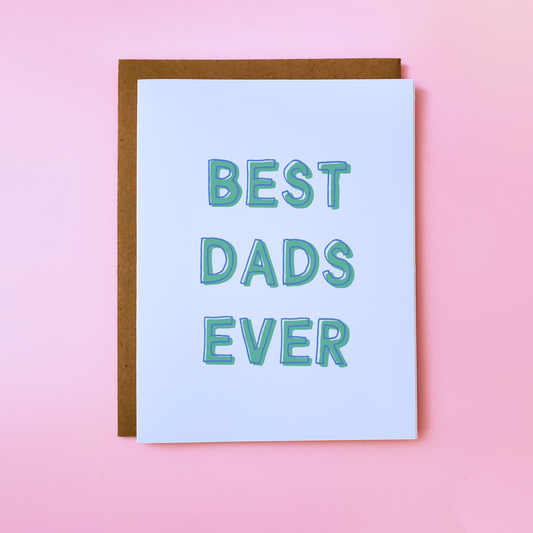 Image shows a LGBTQ Parent Card on pink background. Gay Father's Day Card reads 'Best Dads Ever'.
